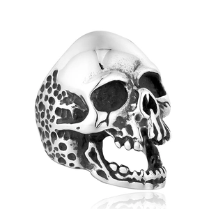 Macro detail of gothic skull ring showing realistic bone texture and honeycomb patterns