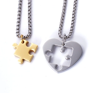 Polished stainless steel puzzle heart necklace set with gold and silver pendants