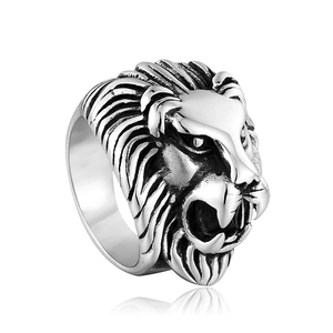 Macro detail of punk style lion head ring with vintage silver finish and steel texture