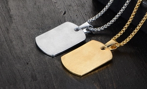 Macro shot of brushed stainless steel dog tag pendants in silver and gold finishes
