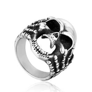 Macro detail of gothic skull ring in vintage titanium steel with bone texture