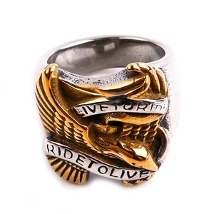 Macro view of biker ring featuring a gold eagle and Live to Ride silver ribbon engraving