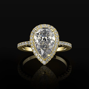 Sparkling pear-cut halo engagement ring with gold band and micro-pave cubic zirconia