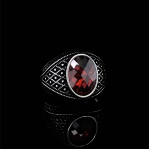 Vintage black metal men's ring with large oval red gemstone and intricate carvings