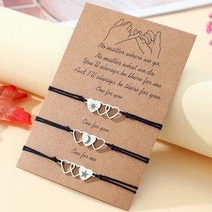 Three-piece sun moon and star heart pendant woven bracelets on a Kraft gift card