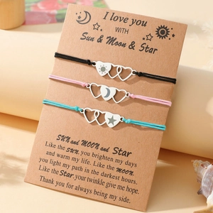 Three-piece woven sun moon and star charm bracelets on a sentiment message card