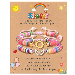 Detail of sun and moon friendship bracelets on sister gift card with colorful heishi beads