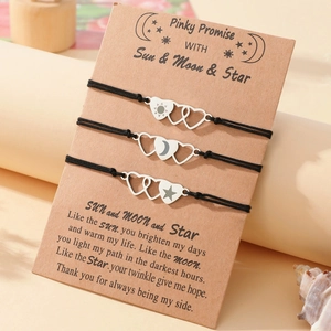 Three-piece Sun Moon and Star woven heart bracelets on a decorative kraft gift card