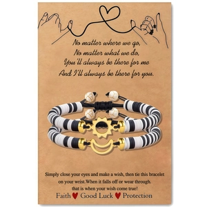 Detail of adjustable sun and moon woven bracelets on a kraft display card with soft clay beads