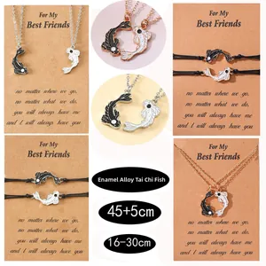 Detail view of Yin Yang fish enamel pendants with adjustable woven rope and chain necklace