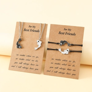 Detail of Yin Yang fish friendship necklaces and woven bracelets on display cards