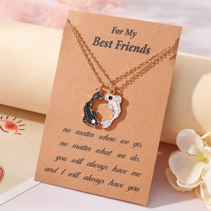 Detail of koi fish puzzle necklaces on For My Best Friends card with golden chains