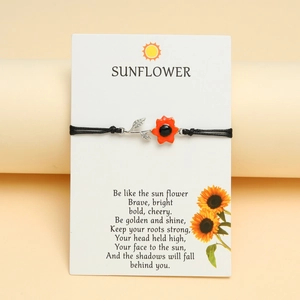 Detail der Sonnenblumen-Emaille-Anhänger auf schwarzer Kordel mit Motivationskarte