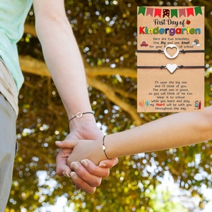 Detail of mother and daughter bracelets set on a First Day of Kindergarten theme card