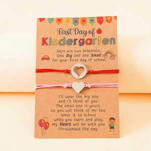 Handmade woven bracelet set with heart charms on First Day of Kindergarten card