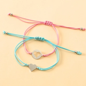 Macro detail of hand-woven heart bracelets with adjustable pink and blue wax ropes