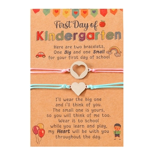 Detail of pink and blue woven bracelets on First Day of Kindergarten gift card