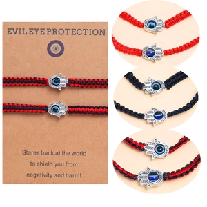 Détails des bracelets Hamsa tissés avec pendentifs mauvais œil en rouge et noir