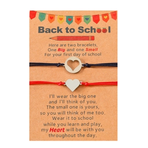 Detail of woven mother-daughter heart bracelets on Back to School theme gift card