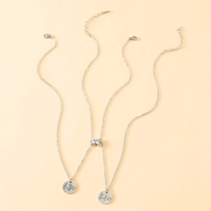 Magnetic couples necklace in stainless steel with engraved round pendants and heart clasp