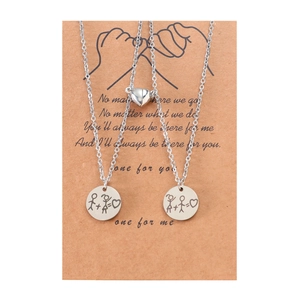 Magnetic stainless steel couple necklaces set with stick figure pendants on gift card