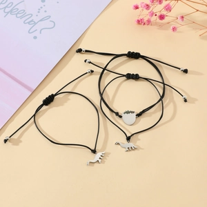 Three-piece dinosaur and egg pendant braided bracelets with adjustable black wax cords