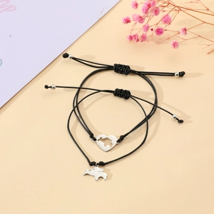 Detail of adjustable black woven ropes with silver heart and elephant charms for school