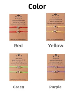 Detailed view of woven cat paw friendship bracelets in red, yellow, green and purple