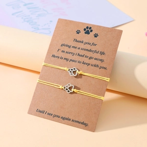 Handmade yellow braided wax rope bracelet set with hollow paw print metal charms