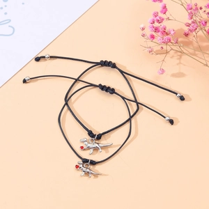 Pair of adjustable dinosaur charm bracelets with red heart detail for parent and child