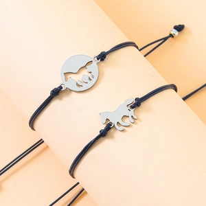 Matching stainless steel horse charms on black braided cords with orange display