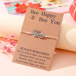 Handmade woven friendship bracelet with silver infinity symbol and Sister charm on bee card