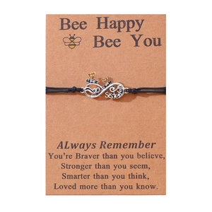 Handmade infinity sister bracelet with bee charm on card for friendship gift