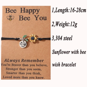 Detail view of adjustable sunflower and bee wish bracelet with 304 stainless steel charm