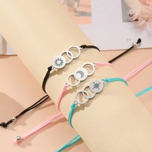 Three-piece sun moon star engraved charms on adjustable woven friendship bracelets