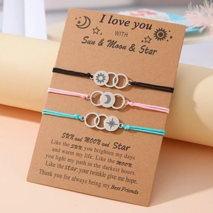 Three-piece sun moon star braided bracelets set on a poetic gift card for couples