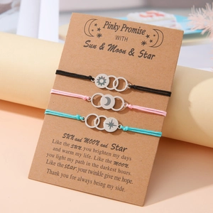 Three-piece sun moon star woven friendship bracelets on a pinky promise card