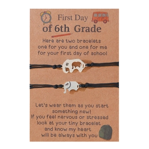 Adjustable black woven bracelets with silver elephant charms on 6th grade school card