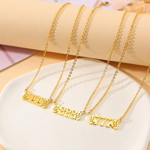 Detailed view of gold angel number necklaces 777 888 999 with delicate butterfly wings