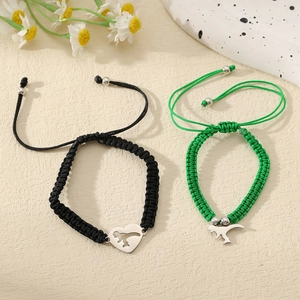 Detail von Dinosaurier-Charm-Armbändern mit Nylonkordel und verstellbarer Edelstahlperle