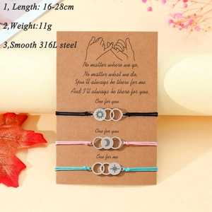 Detailed view of adjustable sun moon star bracelets on a gift card with 316L steel charms