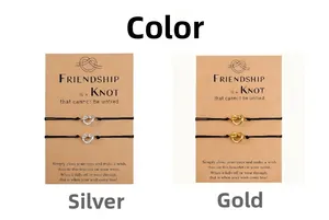 Handmade friendship bracelets with stainless steel knot charms on display cards