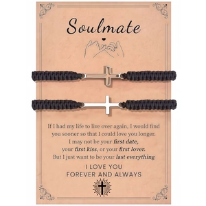 Macro detail of braided couple bracelets with silver cross charm on Soulmate gift card