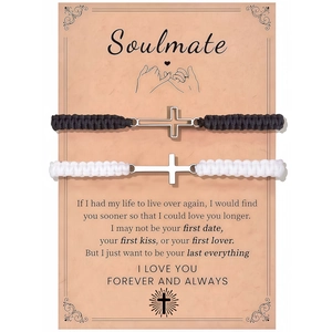 Detail of cross charm braided couple bracelets on a Soulmate gift card display