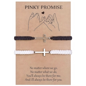 Couples braided cross bracelet set in black and white on a Pinky Promise gift card