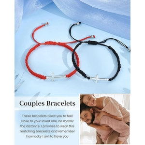 Detail of adjustable woven couple bracelets with polished metal cross charms in black and red