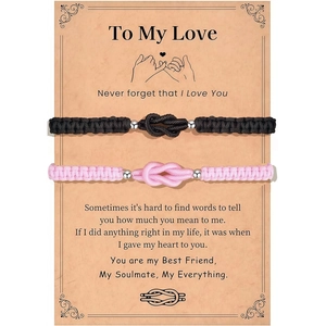 Paar geflochtene Armbänder in Pink und Schwarz mit Silberperlen auf einer Geschenkkarte