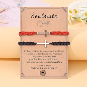 Matching cross bracelets for couples in black and red woven rope on Soulmate gift card