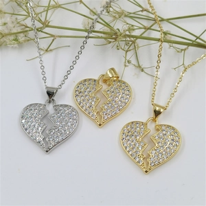 Sparkling broken heart pendant necklace with clear zircons in gold and silver finish