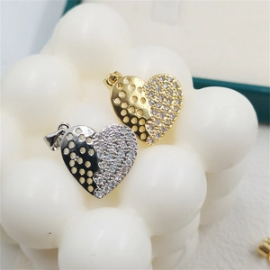 Two-tone heart pendant with hollow sun detail and sparkling white zircon inlays
